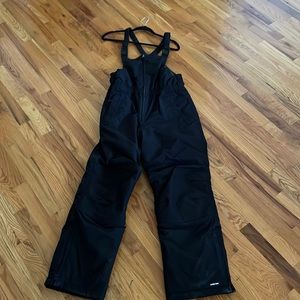 Kids size 16 Husky Squall Waterproof Iron Knee Bibs. Never worn but no tags